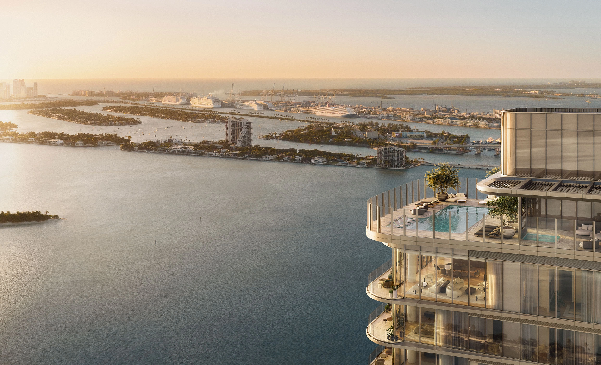 Edgewater Miami condos: LILLI rooftop pool overlooking Biscayne Bay and islands at sunset.
